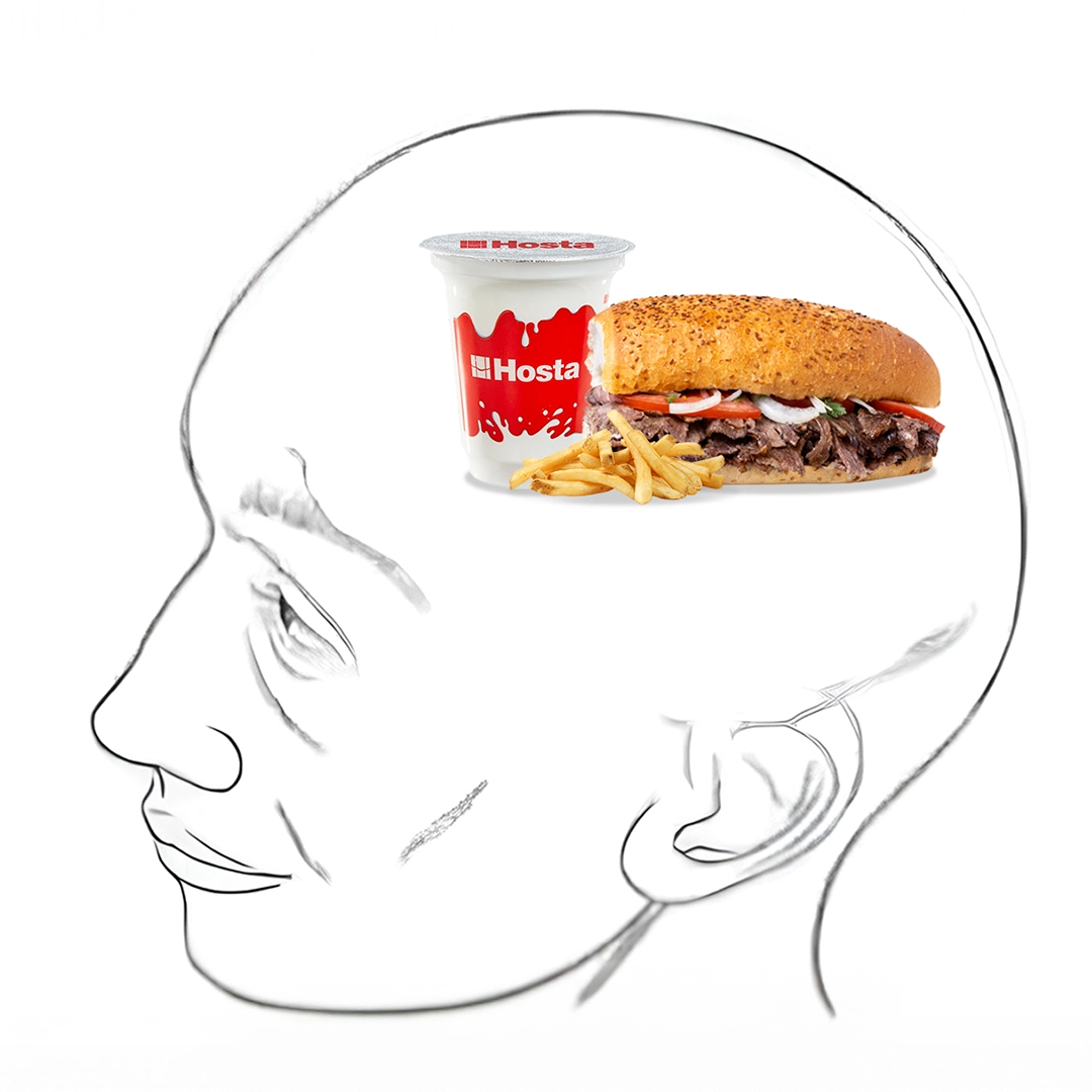 Bir insan silueti çizimi içinde, kafasının içinde Hosta ekmek arası döner, patates kızartması ve ayran yer alıyor.