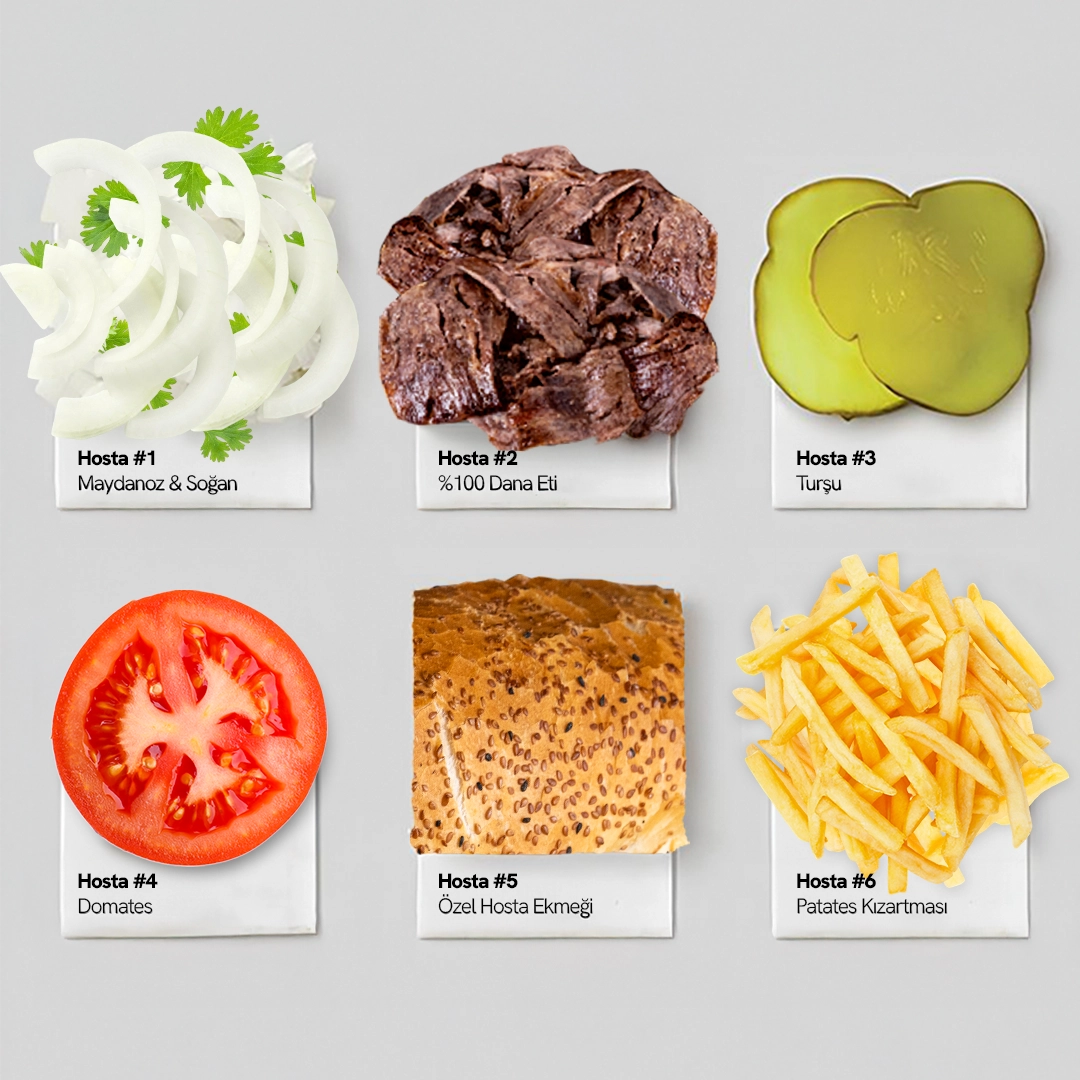 Hosta ekmek arası dönerin içinde yer alan dana eti, maydanoz, soğan, domates, turşu ve patates kızartması detaylı şekilde görülüyor. Özel Hosta ekmeğiyle sunulmuş.