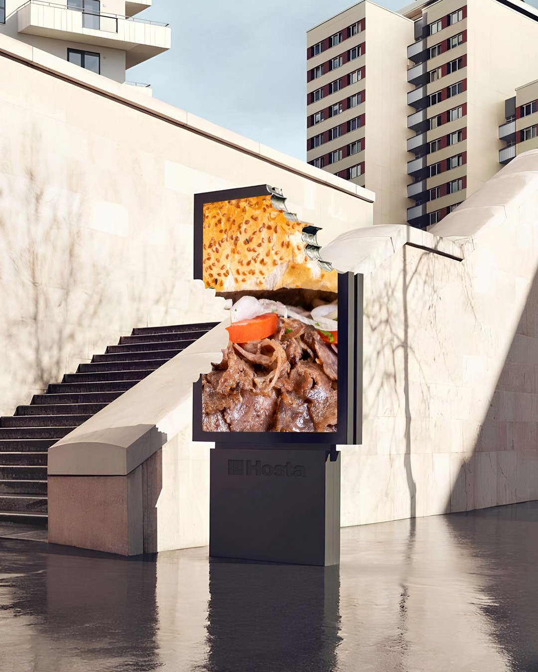 İki ısırık alınmış bir reklam tabelası üzerinde Hosta Ekmek Arası döner görseli yer alıyor.